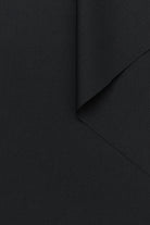 Fabric swatch of wool twill in black color for women's suiting