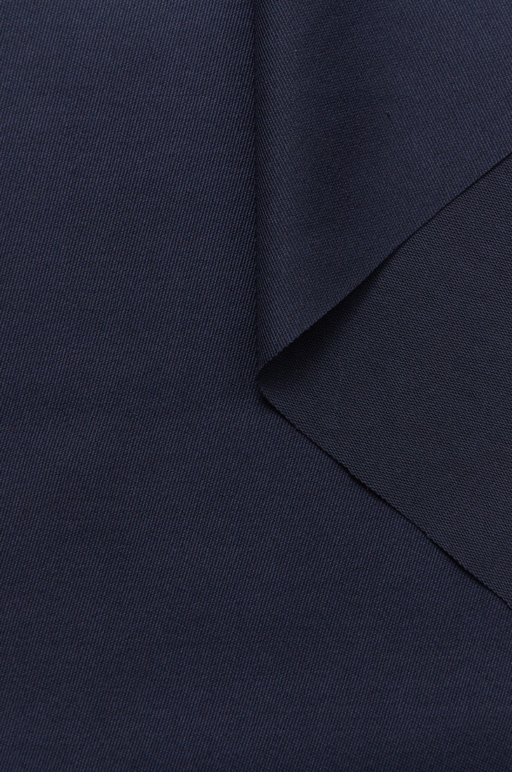 zoom matière gabardine de laine bleu marine issue de stocks dormants pour tailleurs femme Made in France par Facettes Studio